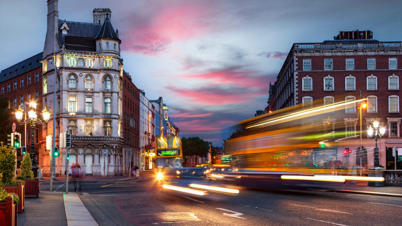 Dublin city streets at night with traffic lights and historic buildings