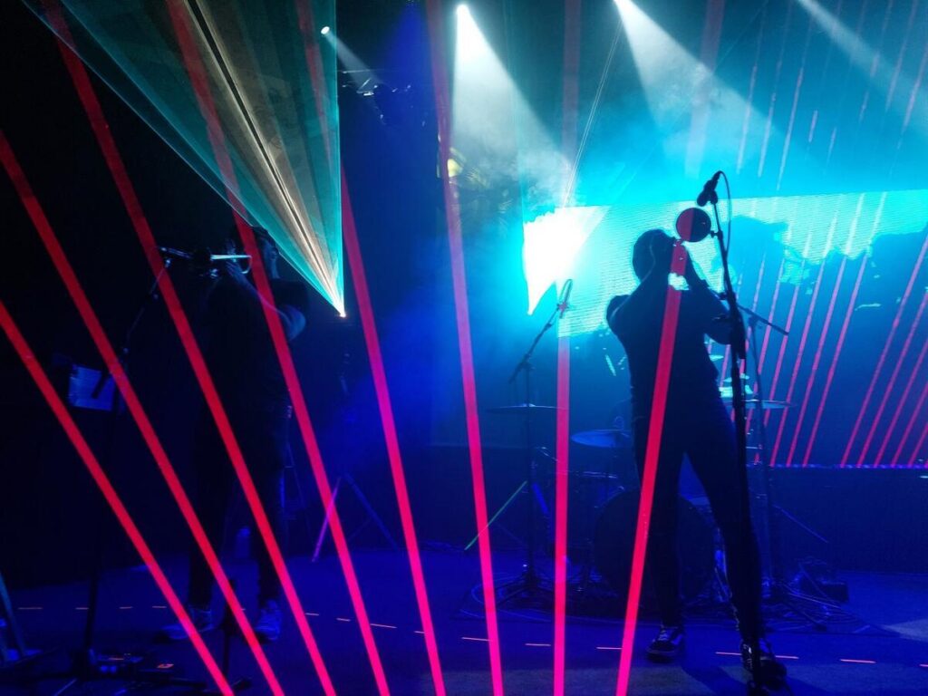 Picture of band playing at Vicar street, Dublin, known for concerts and comedy shows.