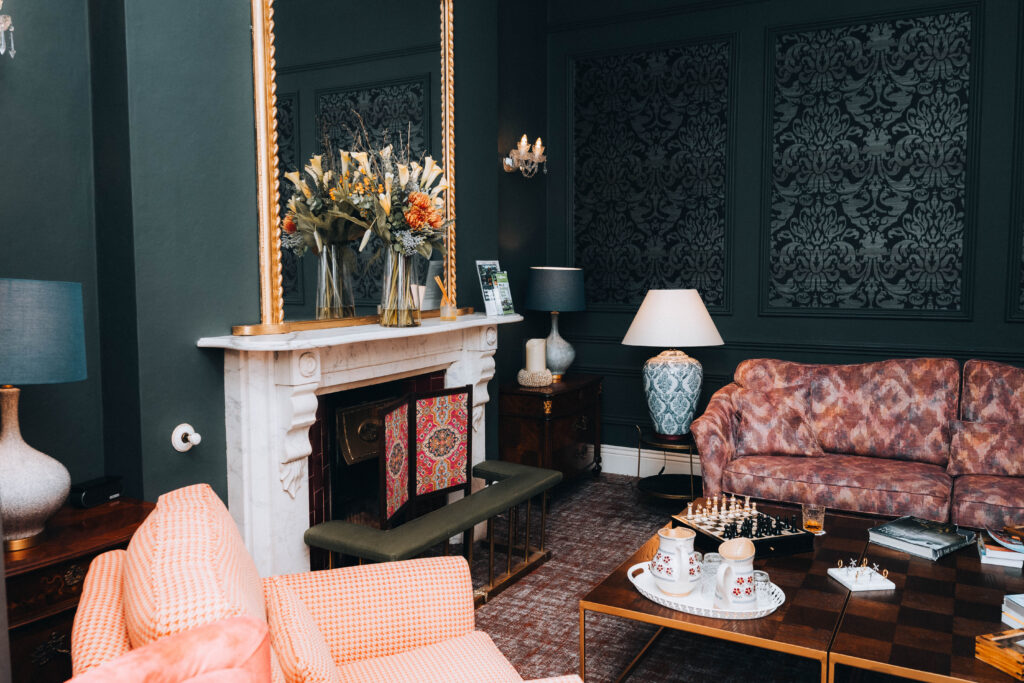 Elegant lounge at Ariel House Dublin with fireplace and chess table