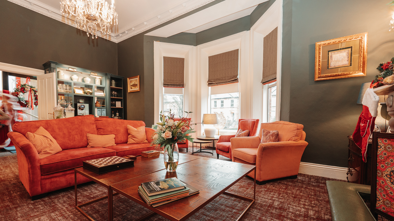 Cosy drawing room at Ariel House Dublin with plush seating, fireplace, and boutique lounge atmosphere