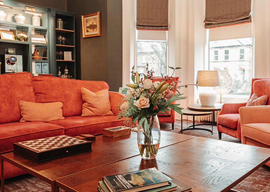 Cosy drawing room at Ariel House Dublin with plush seating, fireplace, and boutique lounge atmosphere